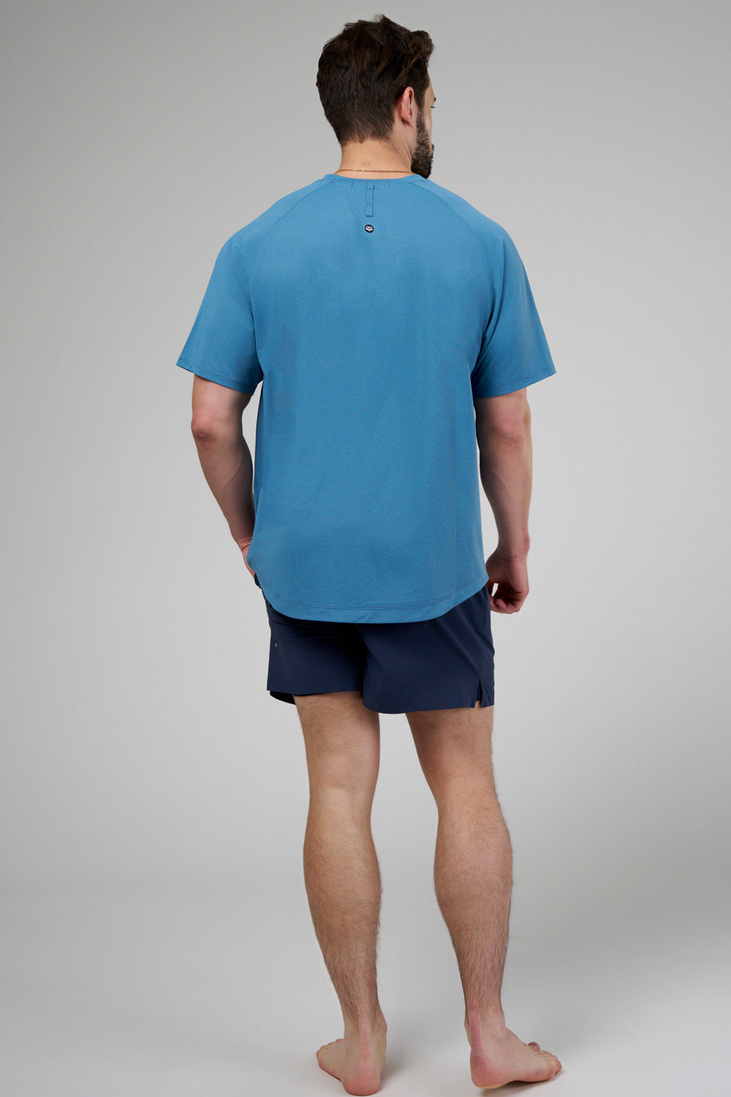 Performance tee with raglan sleeves designed for freedom of movement and all-day comfort.