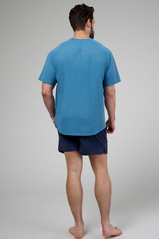 Performance tee with raglan sleeves designed for freedom of movement and all-day comfort.
