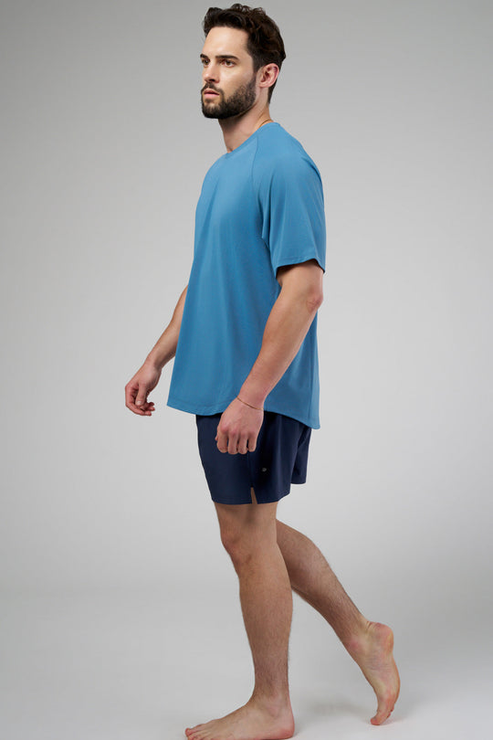 Performance tee with raglan sleeves designed for freedom of movement and all-day comfort.