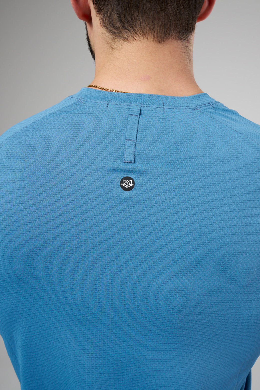 Performance tee with raglan sleeves designed for freedom of movement and all-day comfort.