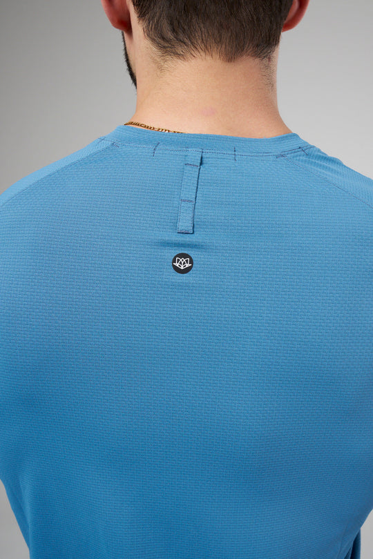 Performance tee with raglan sleeves designed for freedom of movement and all-day comfort.