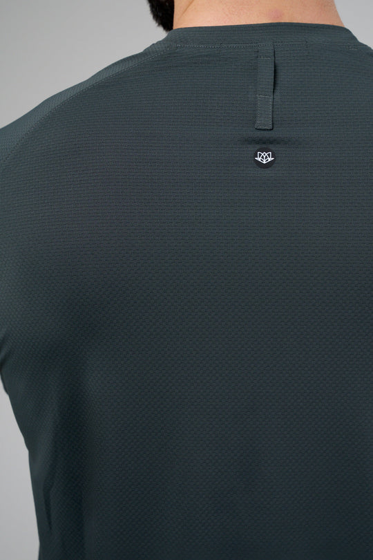 Performance tee with raglan sleeves designed for freedom of movement and all-day comfort.