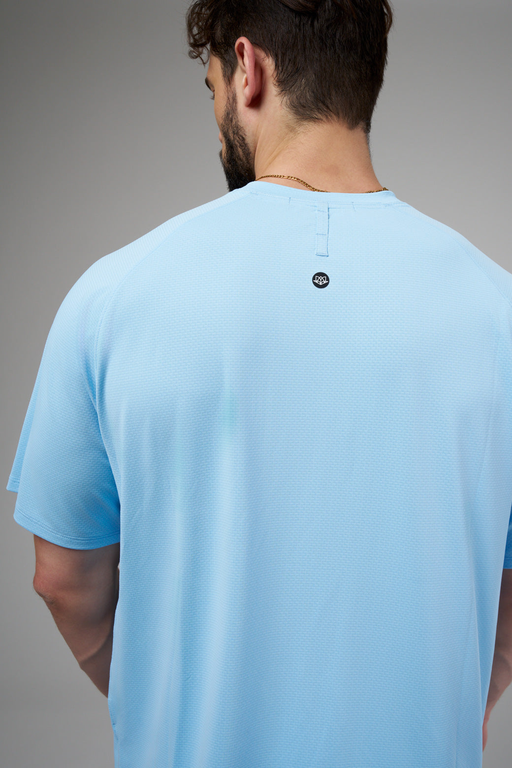 Performance tee with raglan sleeves designed for freedom of movement and all-day comfort.