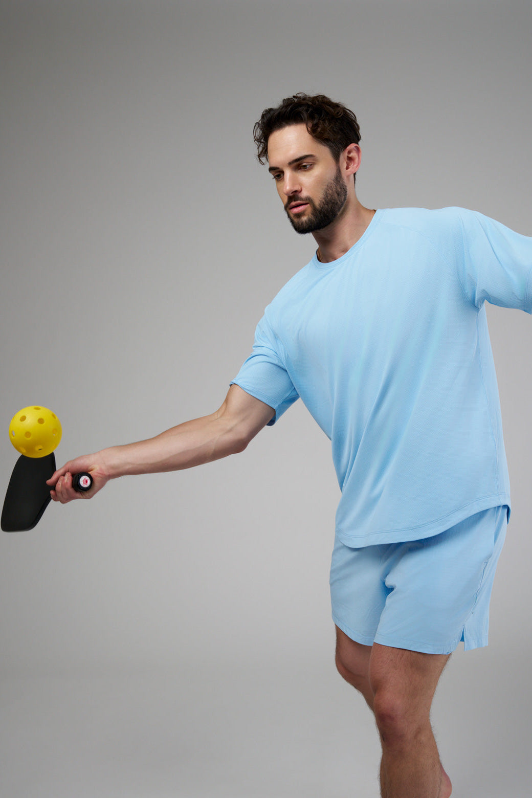 Performance tee with raglan sleeves designed for freedom of movement and all-day comfort.