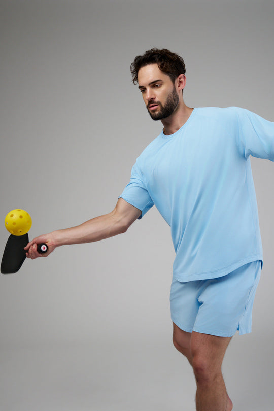 Performance tee with raglan sleeves designed for freedom of movement and all-day comfort.
