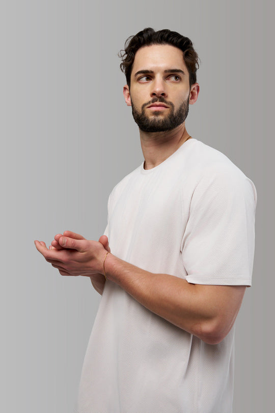 Performance tee with raglan sleeves designed for freedom of movement and all-day comfort.