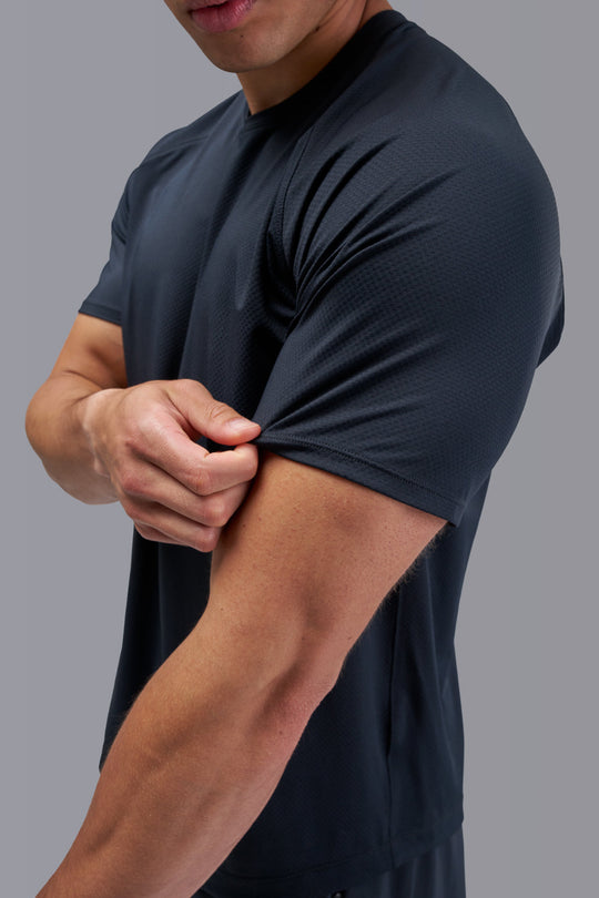 Performance tee with raglan sleeves designed for freedom of movement and all-day comfort.