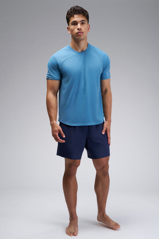 Performance tee with raglan sleeves designed for freedom of movement and all-day comfort.