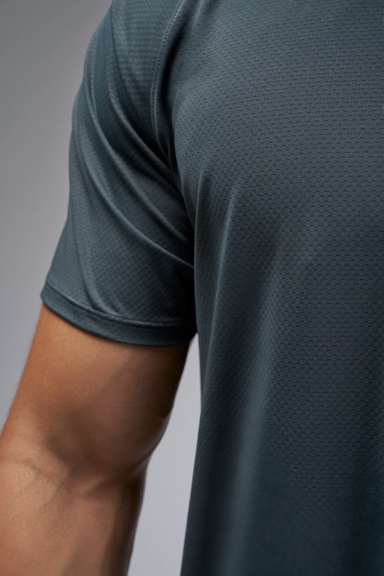 Performance tee with raglan sleeves designed for freedom of movement and all-day comfort.