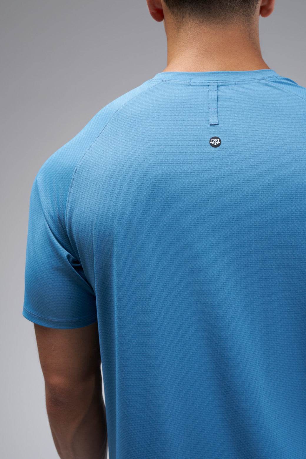 Performance tee with raglan sleeves designed for freedom of movement and all-day comfort.