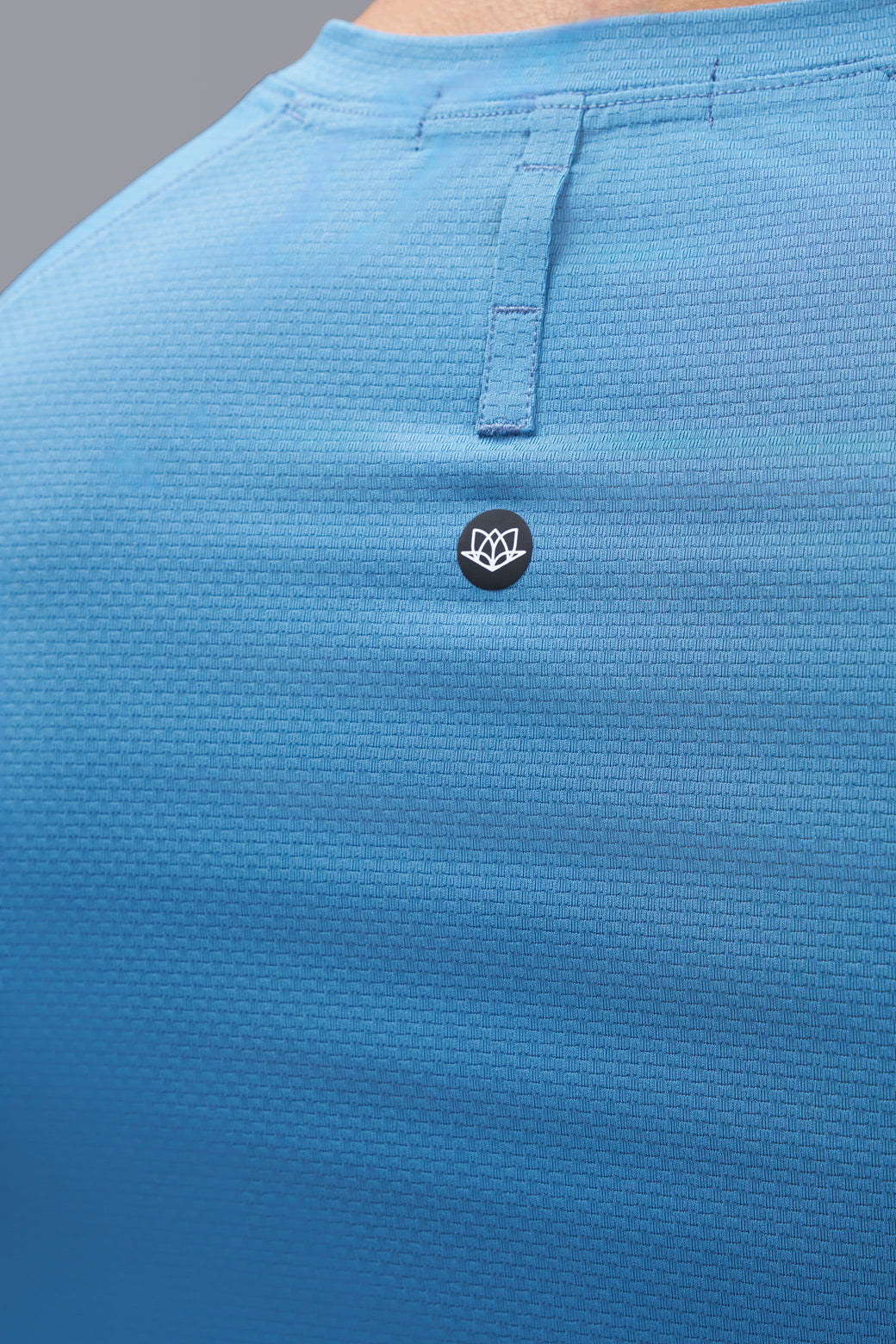 Performance tee with raglan sleeves designed for freedom of movement and all-day comfort.