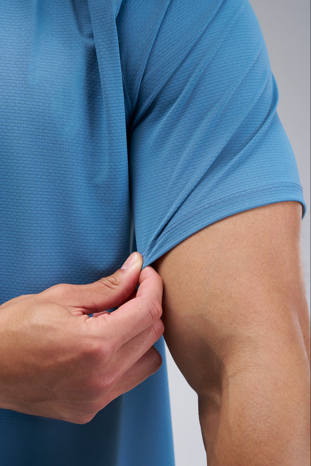 Performance tee with raglan sleeves designed for freedom of movement and all-day comfort.