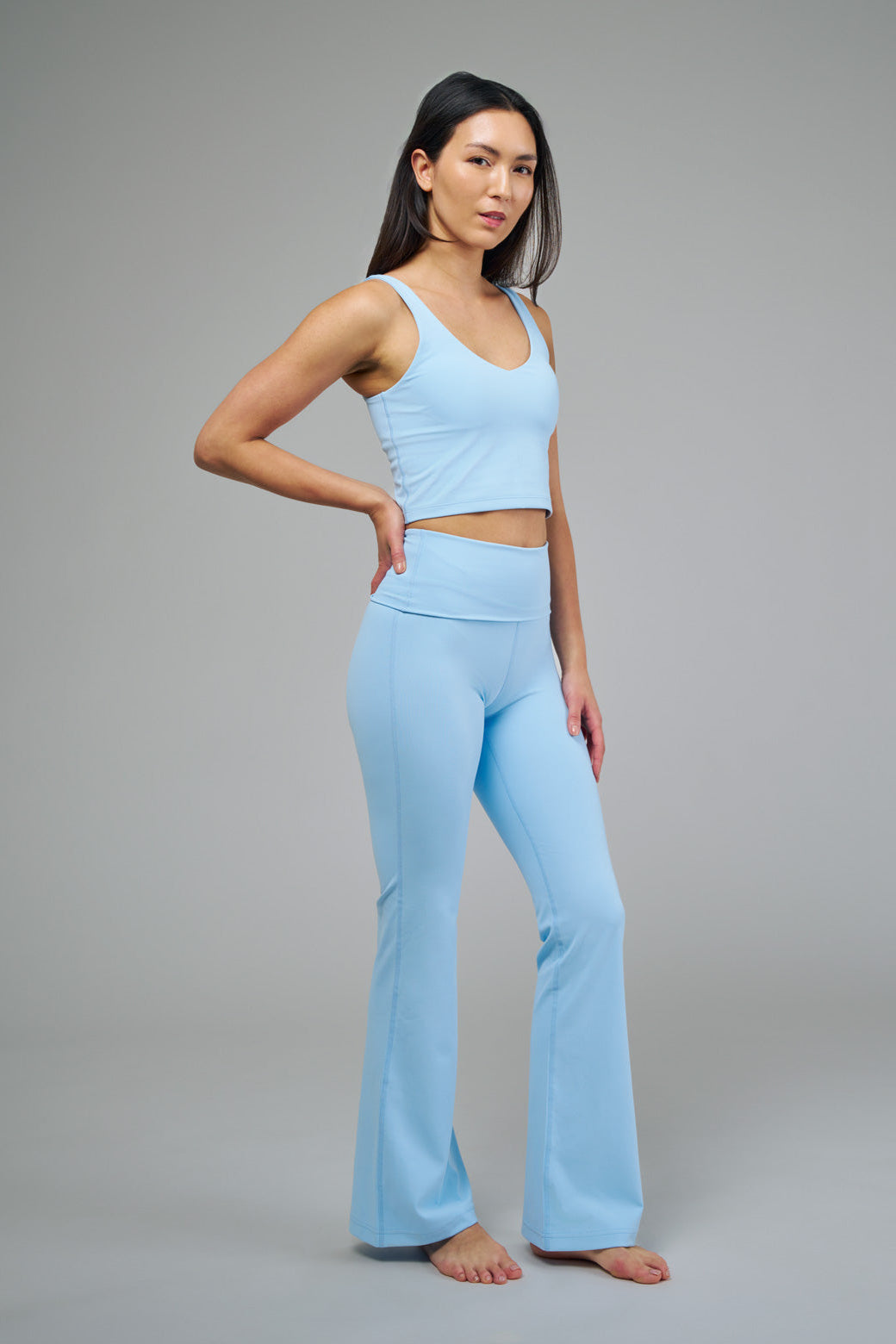 Women's Light Blue Tank Top and Flare Fold-Over Leggings Side Pose