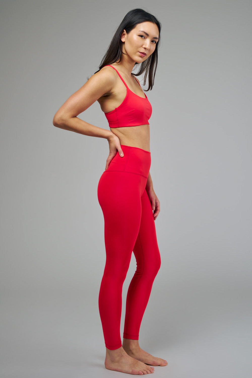 Women's Red Sports Bra and Leggings Side Pose