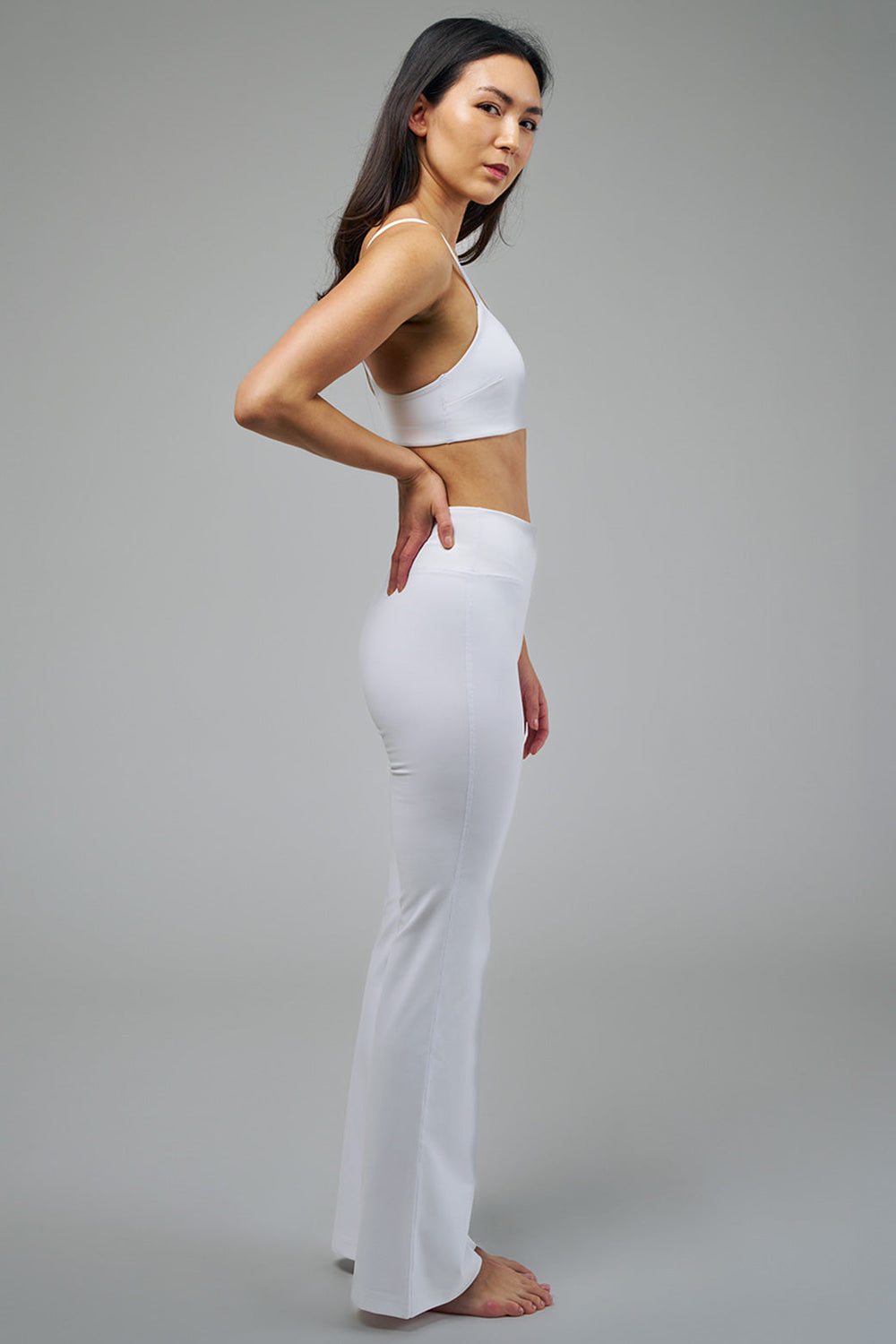Women's White Sports Bra and Flare Leggings Side
