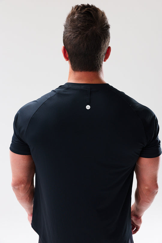 Performance tee with raglan sleeves designed for freedom of movement and all-day comfort.