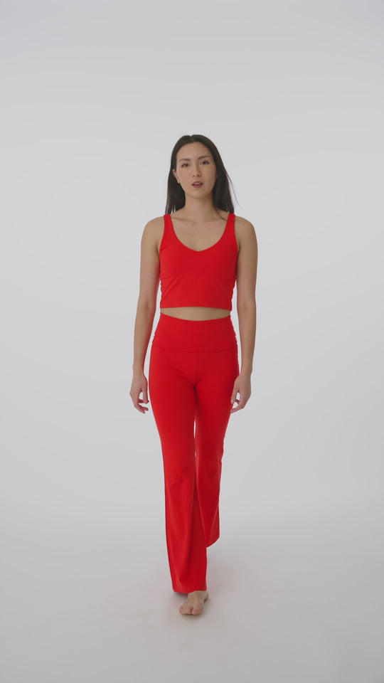 Tank top with built-in bra and removable pads for customizable support.